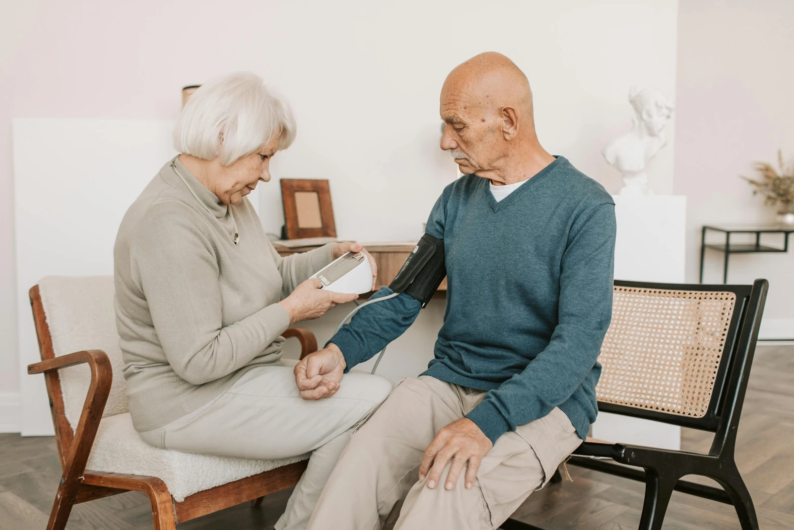 An older couple checks blood pressure