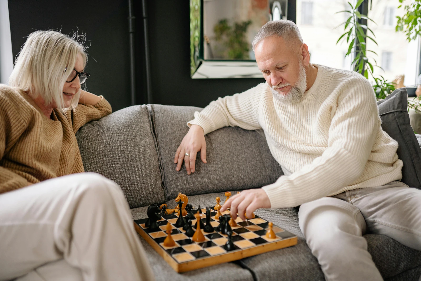 Elderly Couple Playing Chess to Sharpen Memory